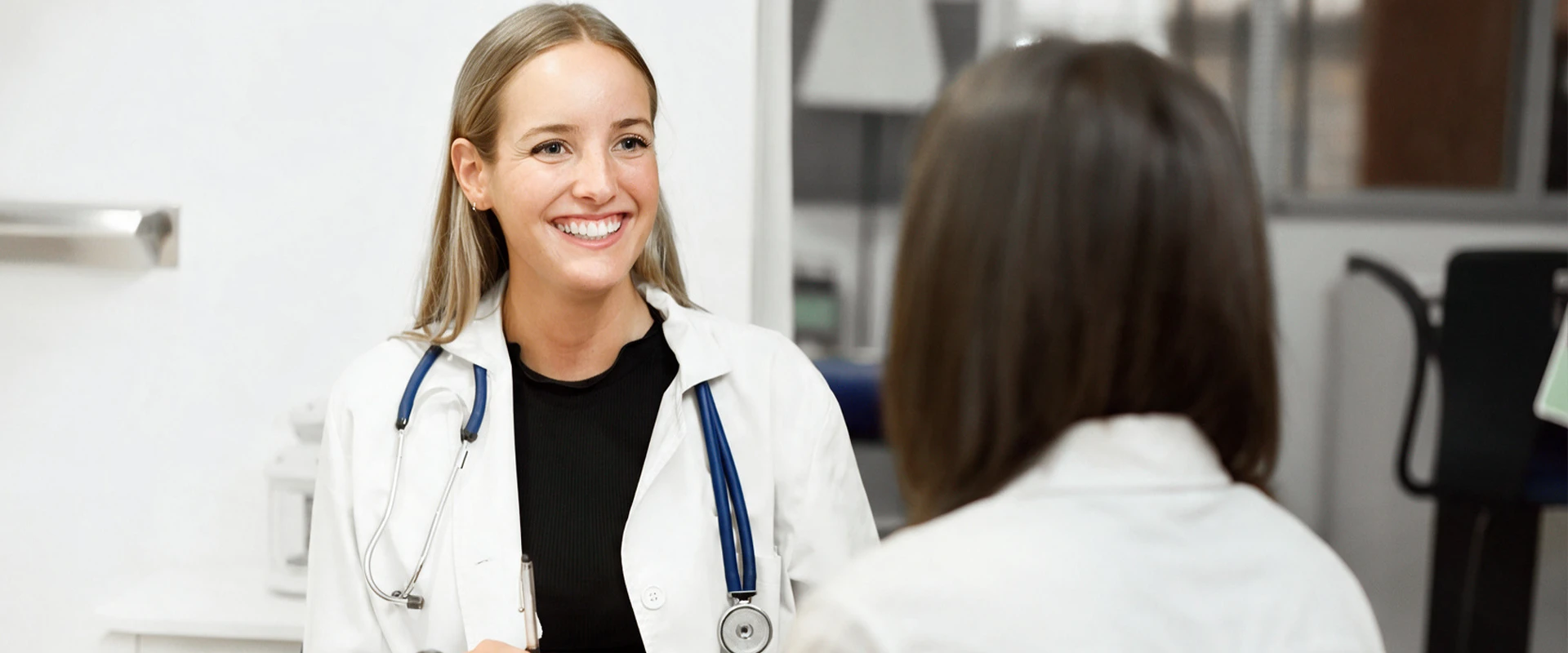 Healthcare professional consulting with a patient